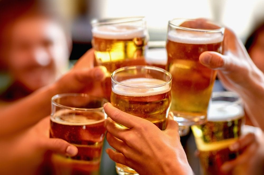 Leisure,,Drinks,,Celebration,,People,And,Holidays,Concept,-,Smiling,Friends Fantastic Breweries in Traverse City 2