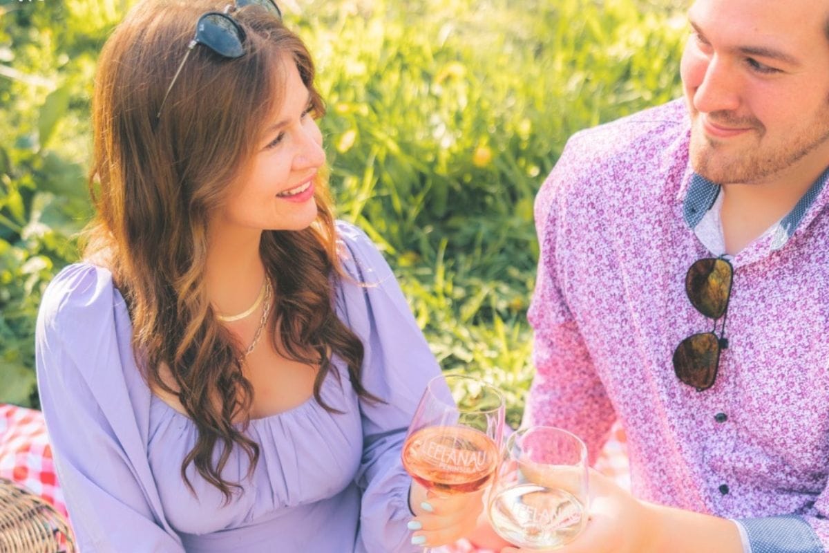A couple enjoying wine outdoors on a spring day