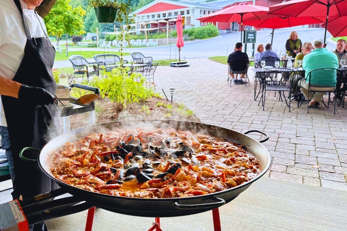 Cooking paella on the bistro patio on a summer evening