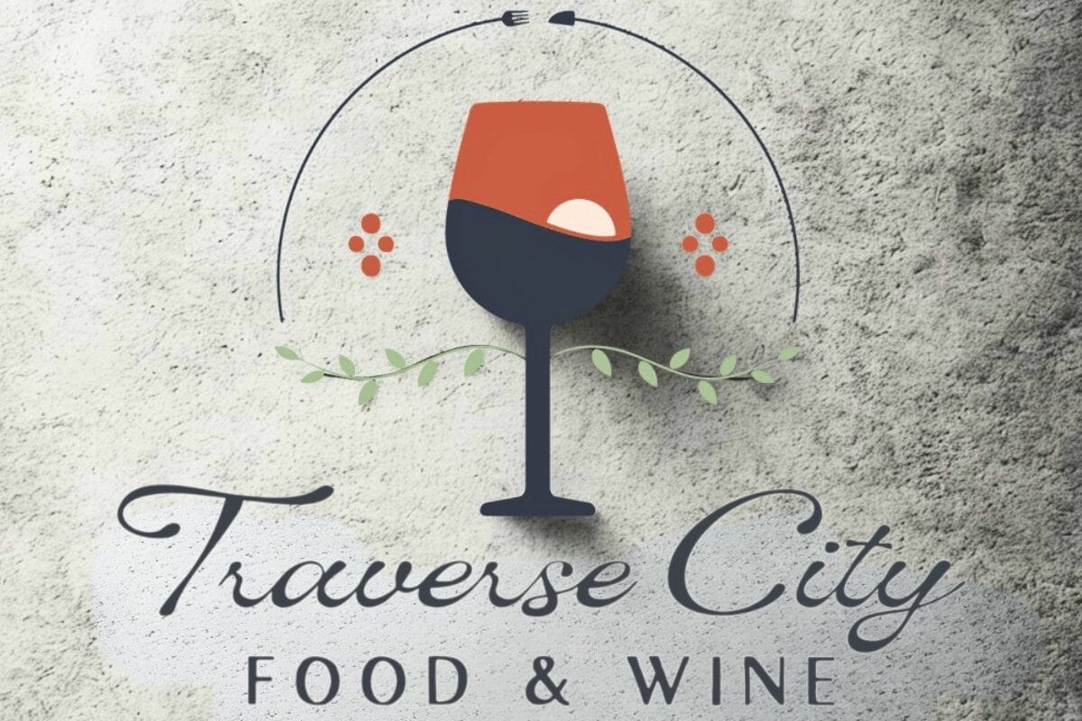 Traverse City Food and Wine Logo with a setting sun in a wine glass